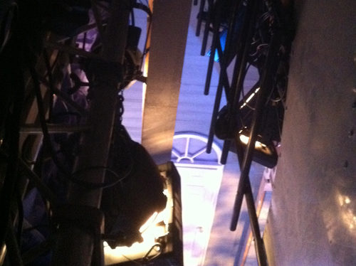 A photo taken looking down at The Watermill stage from The Watermills lighting rig