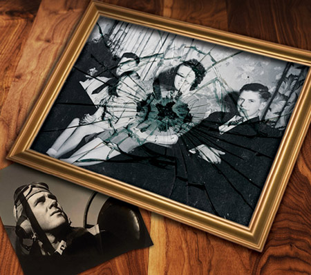 A photo of a smashed frame with a black and white photo in.