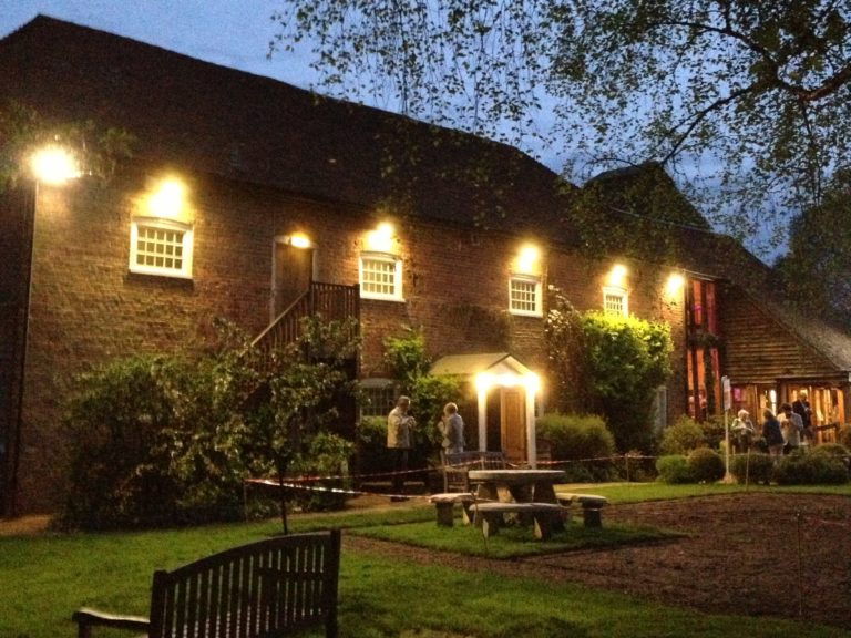 A photo of The Watermill Theatre at night.