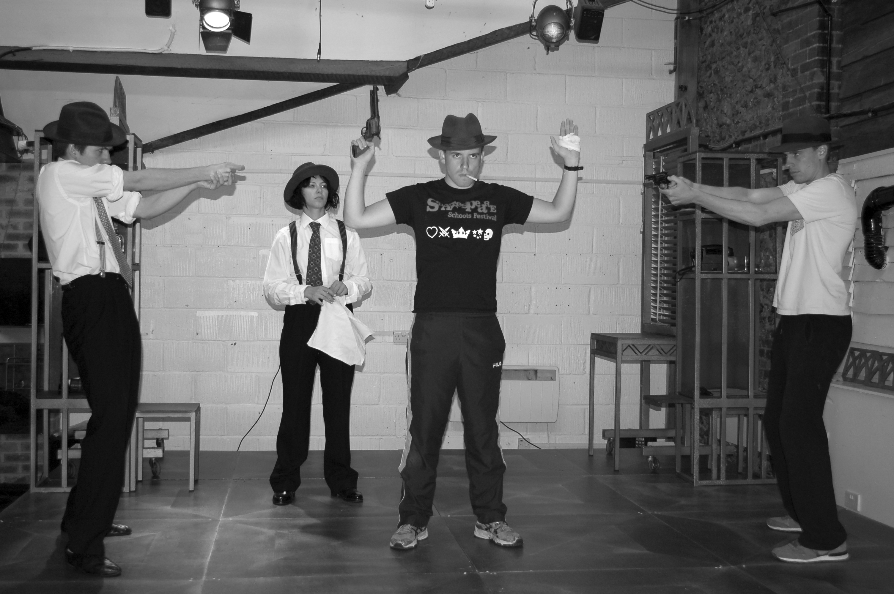 A black and white photo of the cast of Hardboiled in rehearsals.