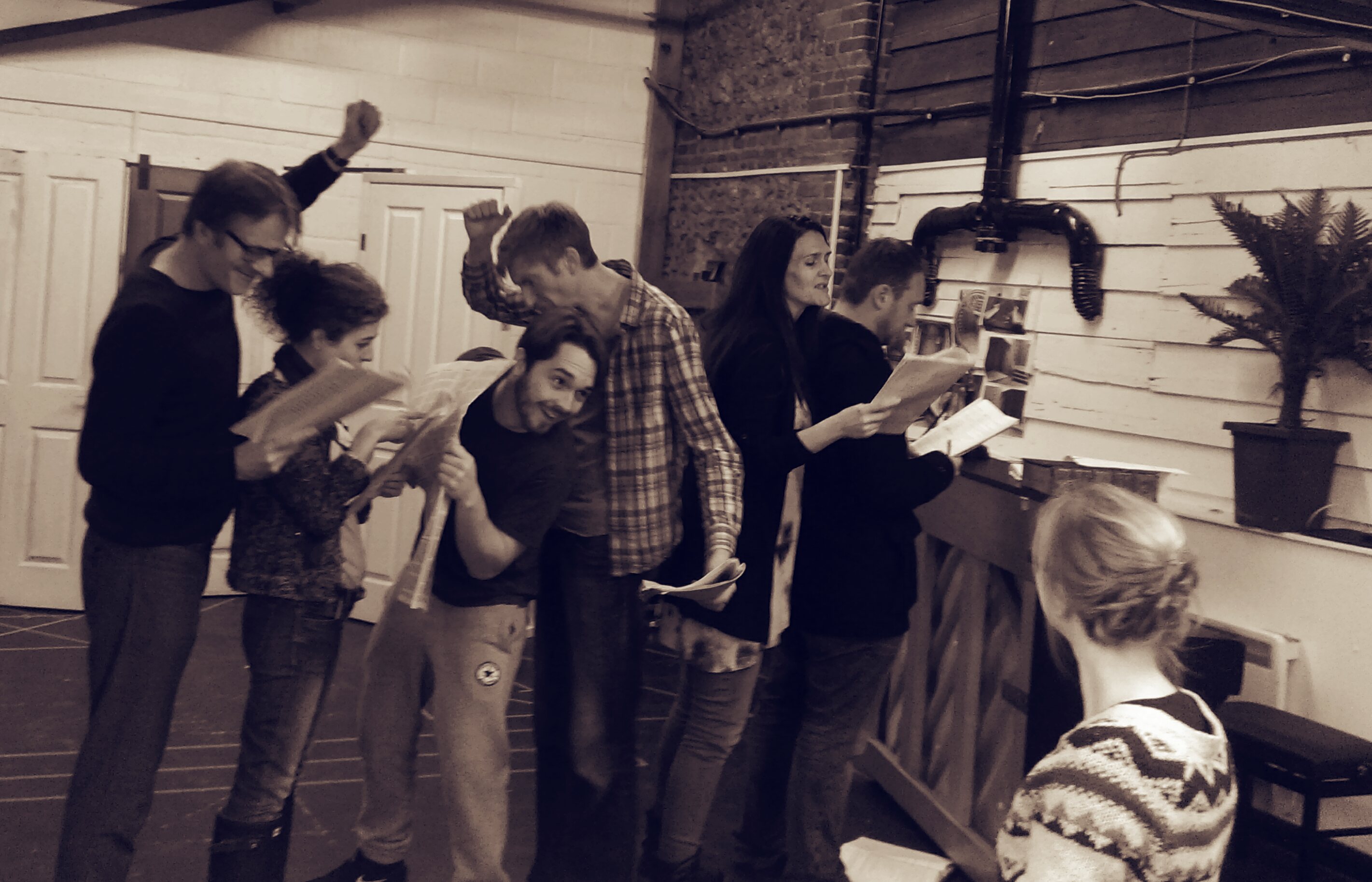 A black and white photo of the cast of The Secret Adversary in rehearsals.