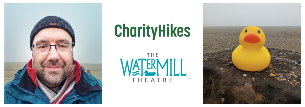 A photo of Simon, The Watermill Theatre and CharityHikes logos and Wilbert the rubber duck mascot.